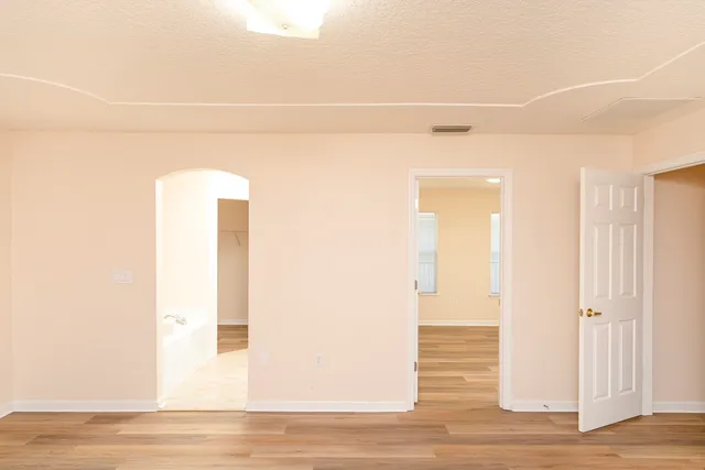 a bathroom with a tub and shower