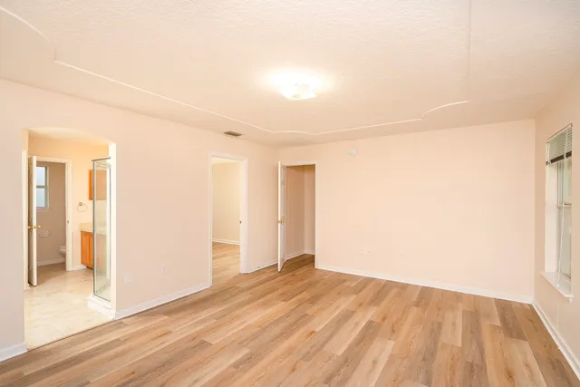 a bathroom with a tub and shower