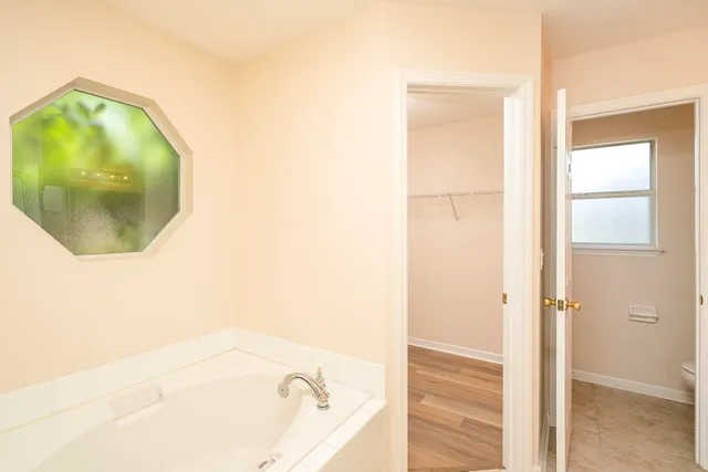 a view of a hallway with closet