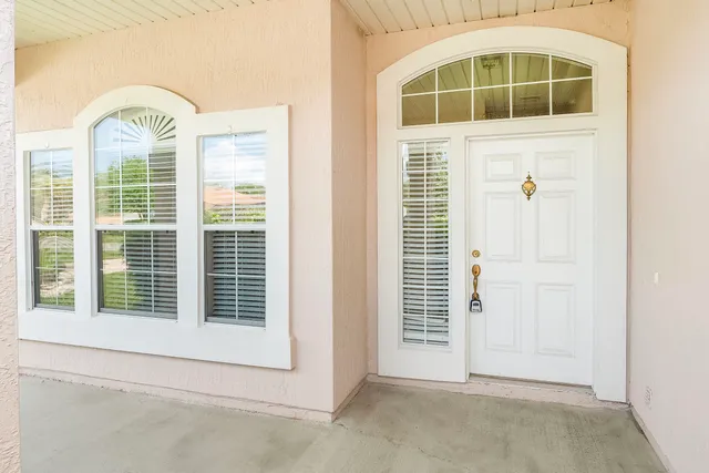 a view of empty room with windows