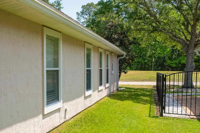 a view of backyard with large trees