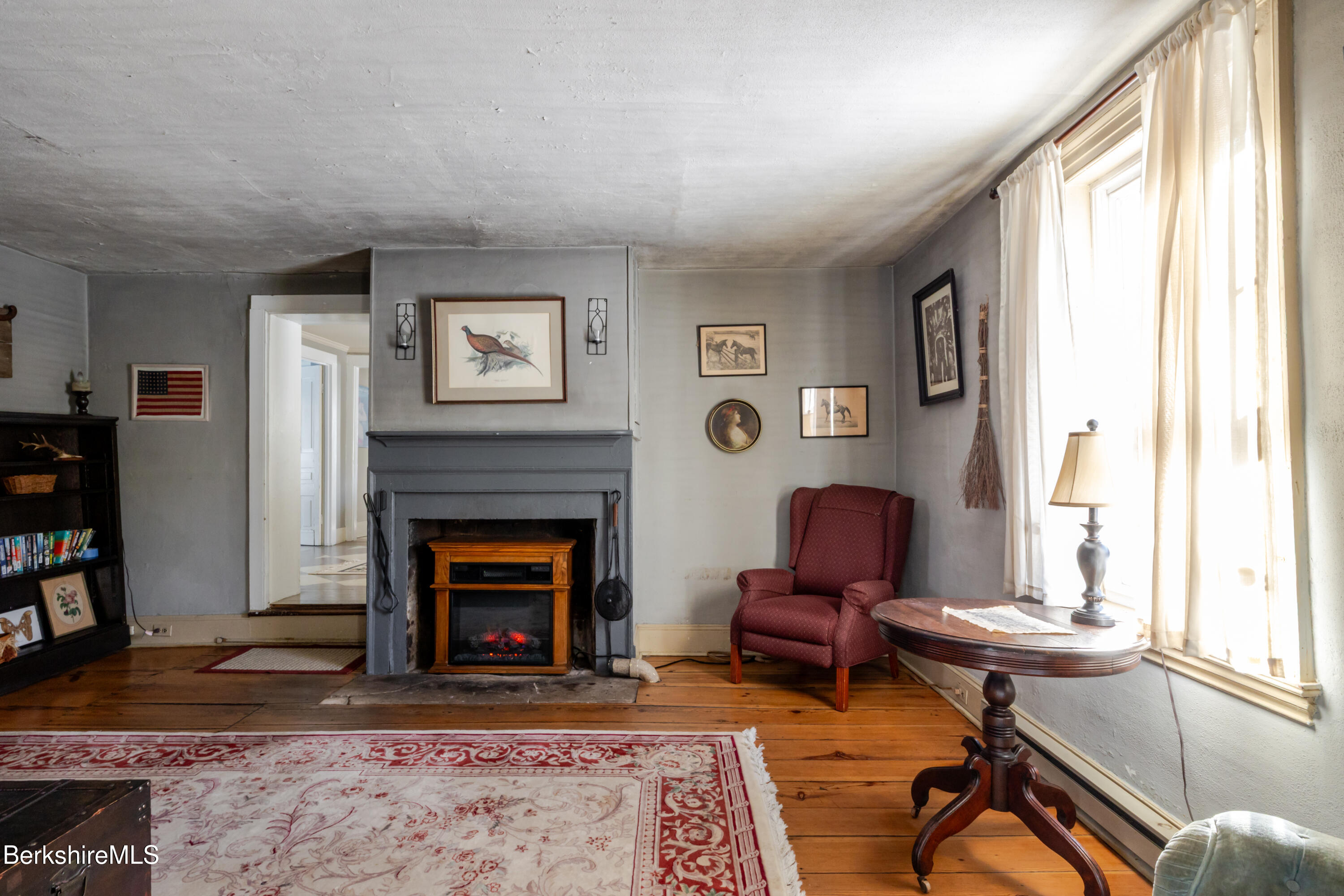 3 Lake Buel Road Great Barrington, MA 01230 - Photo 15 of 55 a living room with furniture and a fireplace