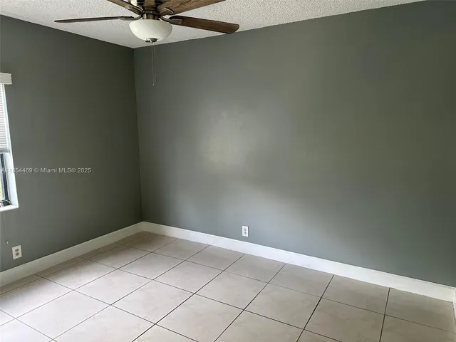 an empty room with a bathroom