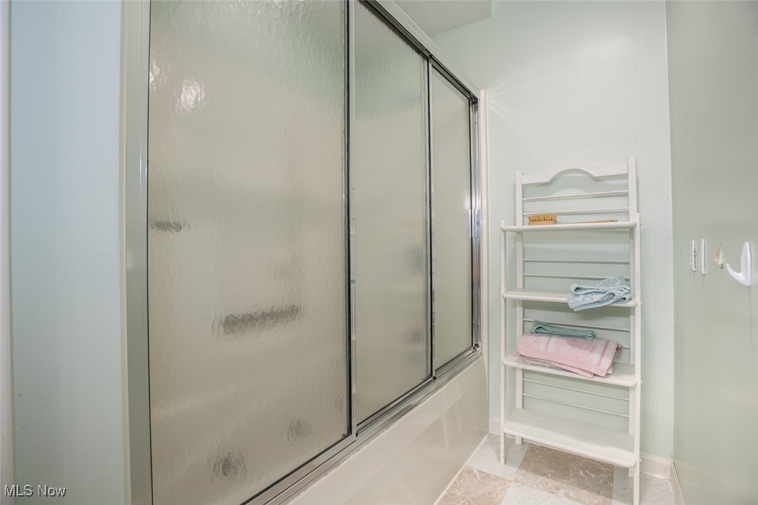 4962 Nettleton Road Medina, OH 44256 - Photo 24 of 43 Full bathroom featuring combined bath / shower with glass door and baseboards