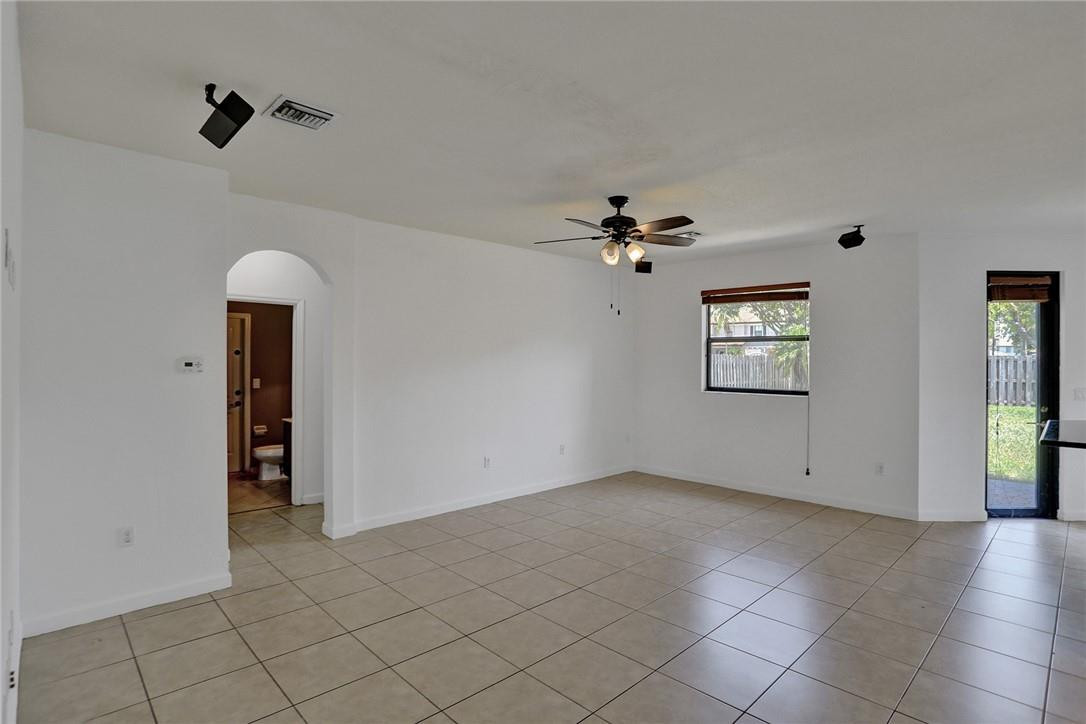 11331 Southwest 240 Lane Homestead, FL 33032 - Photo 13 of 92 an empty room with fan and windows