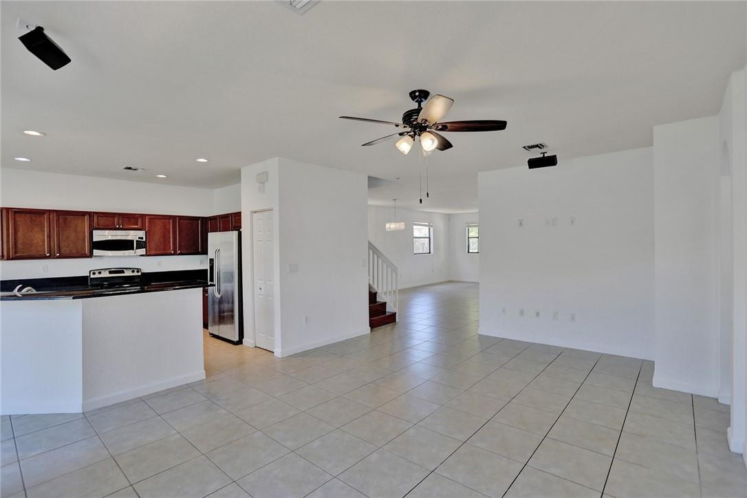 11331 Southwest 240 Lane Homestead, FL 33032 - Photo 16 of 92 a view of kitchen with stainless steel appliances a refrigerator and a stove top oven