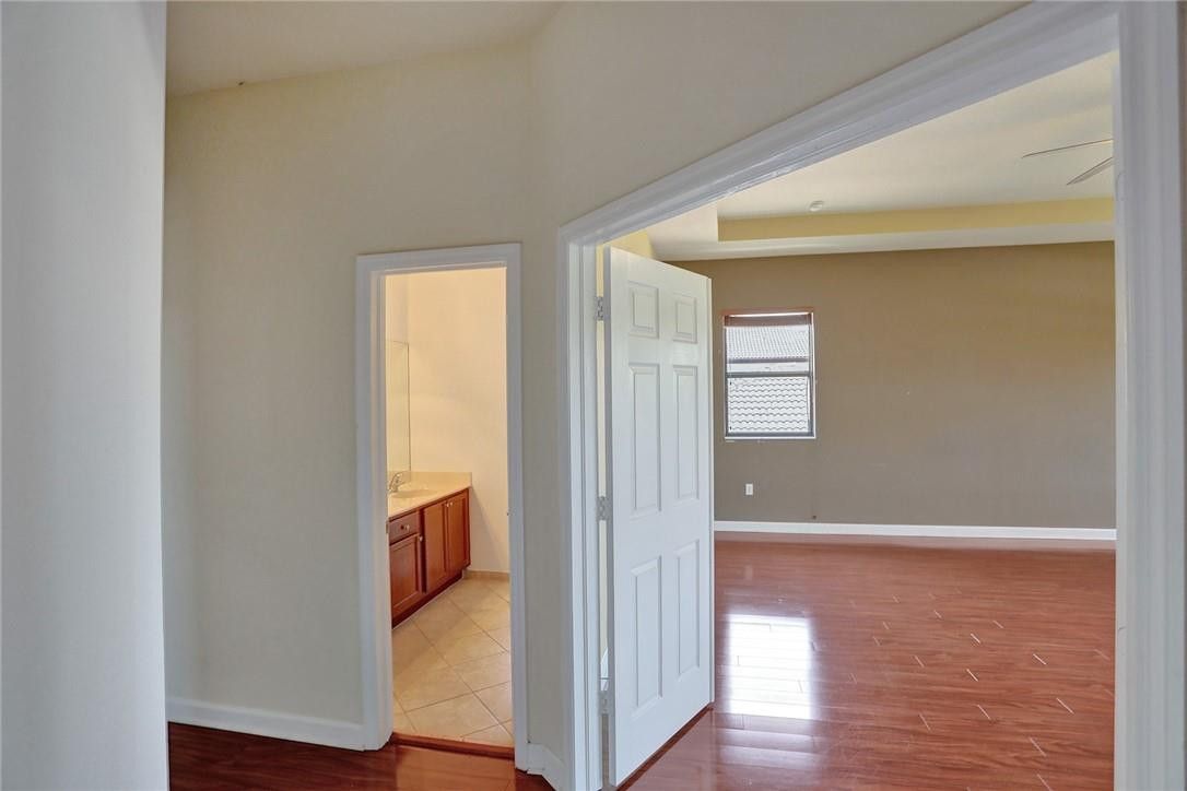 11331 Southwest 240 Lane Homestead, FL 33032 - Photo 36 of 92 a view of walk in closet with wooden floor