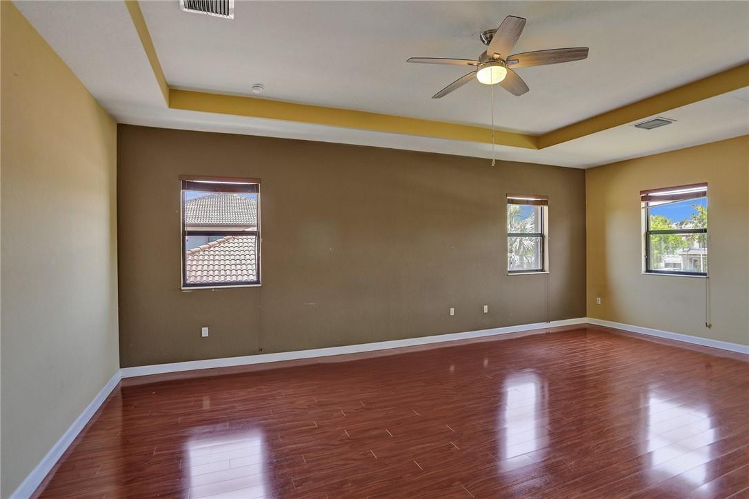 11331 Southwest 240 Lane Homestead, FL 33032 - Photo 38 of 92 a view of empty room with wooden floor and fan