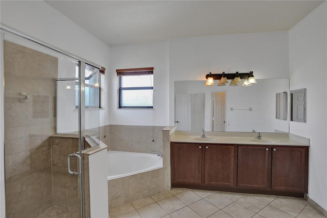 11331 Southwest 240 Lane Homestead, FL 33032 - Photo 45 of 92 a bathroom with a sink and a mirror