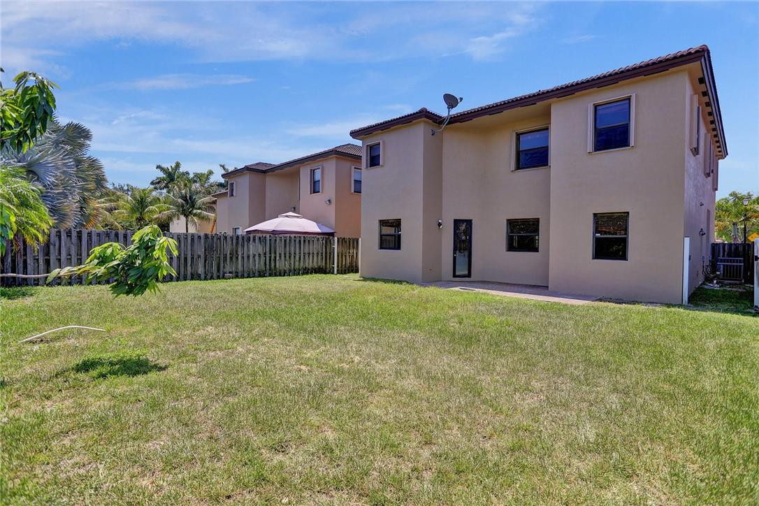 11331 Southwest 240 Lane Homestead, FL 33032 - Photo 5 of 92 a front view of house with yard and outdoor seating