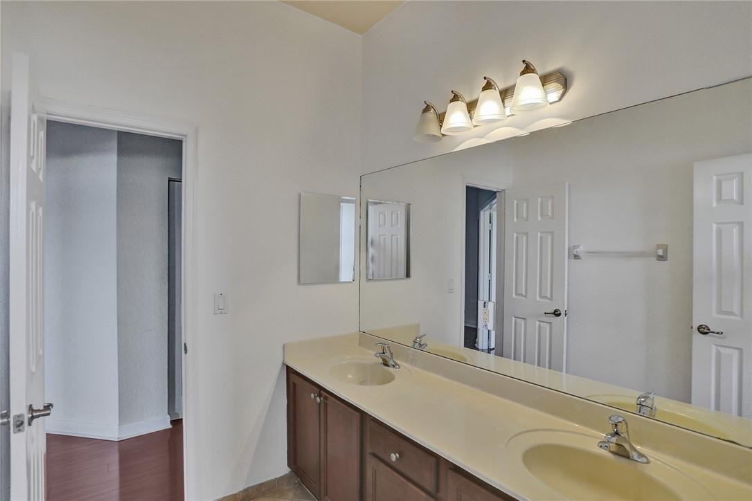 11331 Southwest 240 Lane Homestead, FL 33032 - Photo 51 of 92 a bathroom with a double vanity sink and a mirror