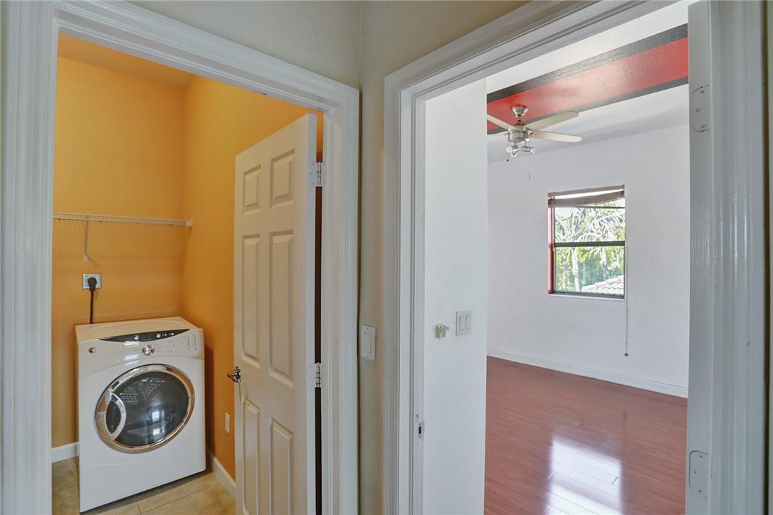 11331 Southwest 240 Lane Homestead, FL 33032 - Photo 52 of 92 a view of a hallway with washer and dryer
