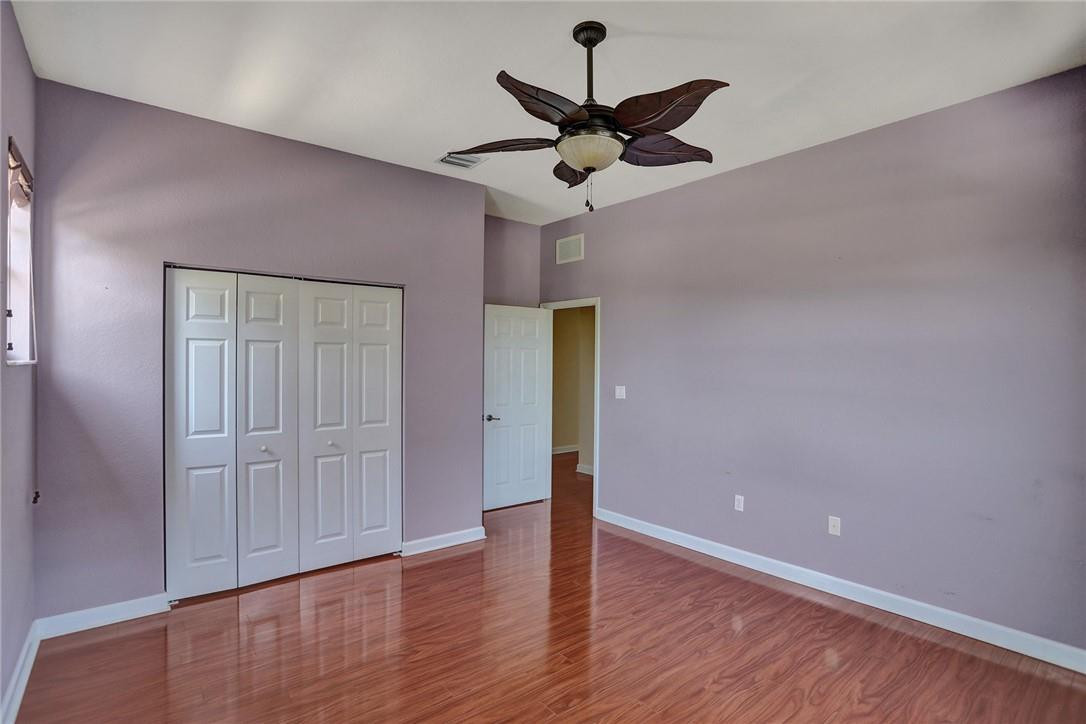 11331 Southwest 240 Lane Homestead, FL 33032 - Photo 59 of 92 a view of an empty room and wooden floor
