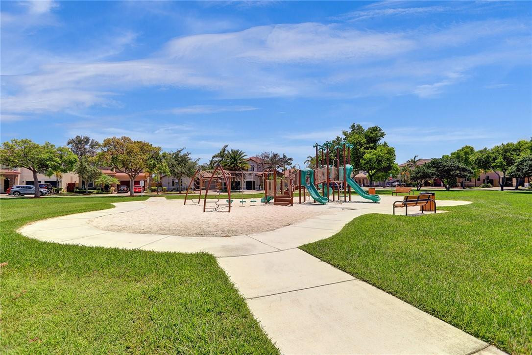 11331 Southwest 240 Lane Homestead, FL 33032 - Photo 66 of 92 a swimming pool with trees in the background