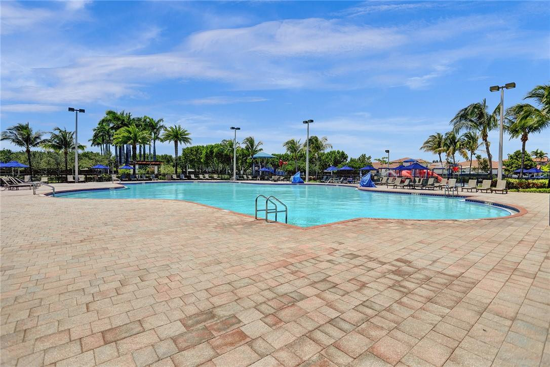 11331 Southwest 240 Lane Homestead, FL 33032 - Photo 68 of 92 a view of a swimming pool and trees in the background