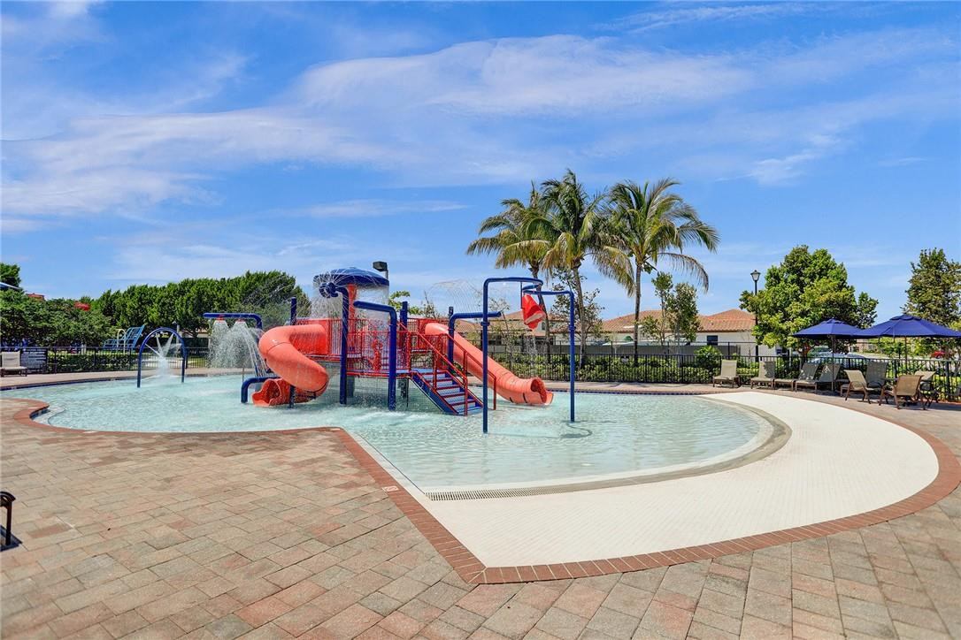 11331 Southwest 240 Lane Homestead, FL 33032 - Photo 85 of 92 a view of swimming pool with outdoor seating and trees in the background
