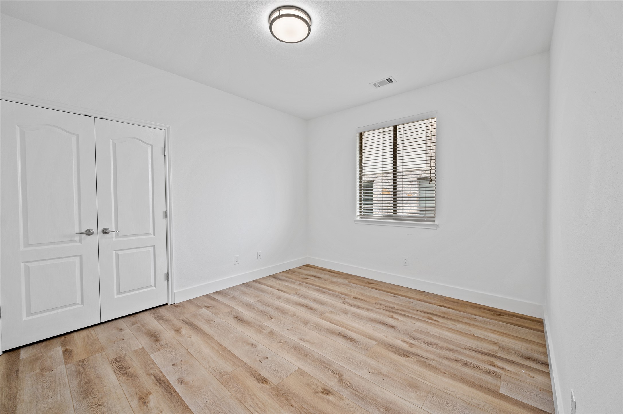 4512 Pyrenees Pass Bee Cave, TX 78738 - Photo 26 of 35 wooden floor in an empty room