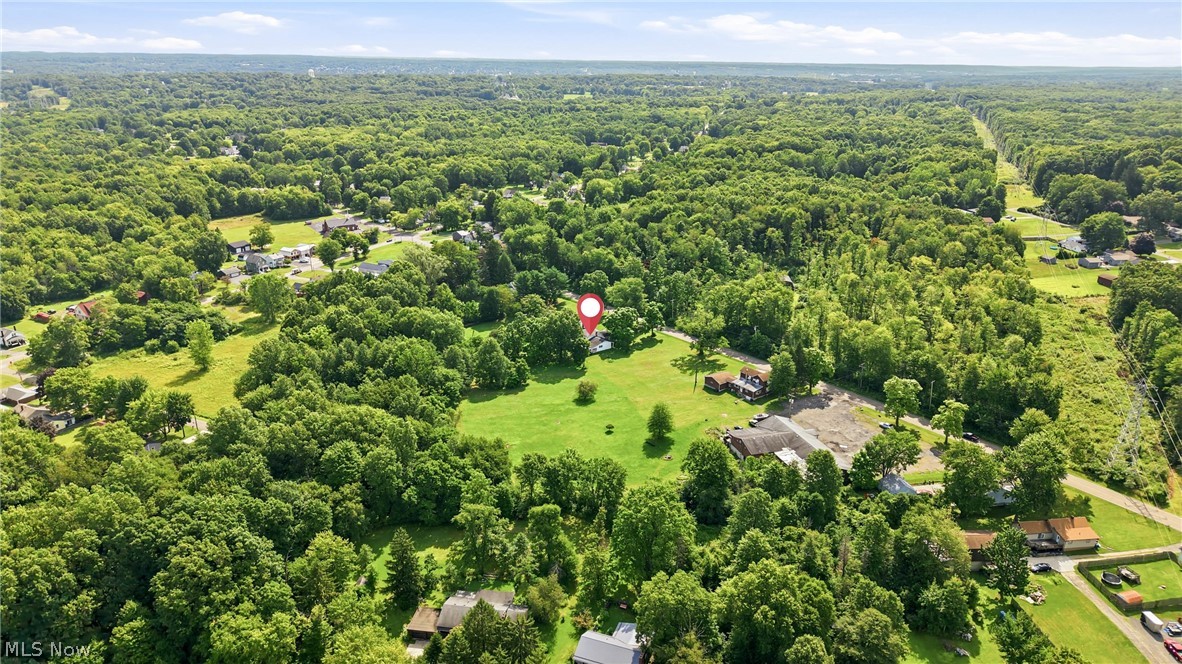 1501 Ohltown McDonald Road Mineral Ridge, OH 44440 - Photo 29 of 32 Expansive property featuring a large open field, mature trees, and a distant treeline
