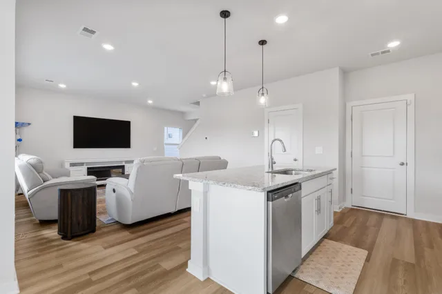 a view of living room with furniture and flat screen tv
