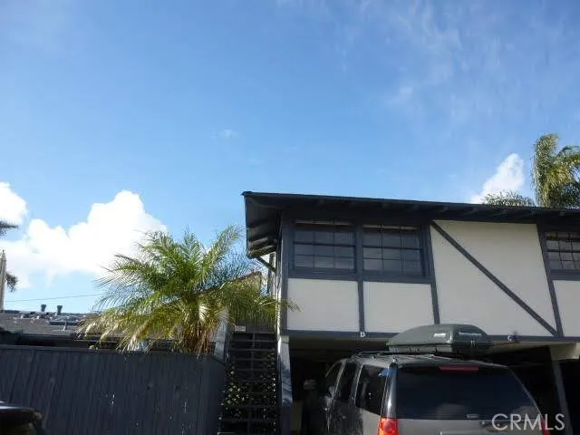 a view of balcony with wooden floor and fence