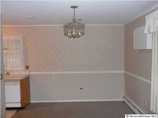 3 Meadowood Road, Unit A Jackson, NJ 08527 - Photo 3 of 3 a view of a room with racks on the wall