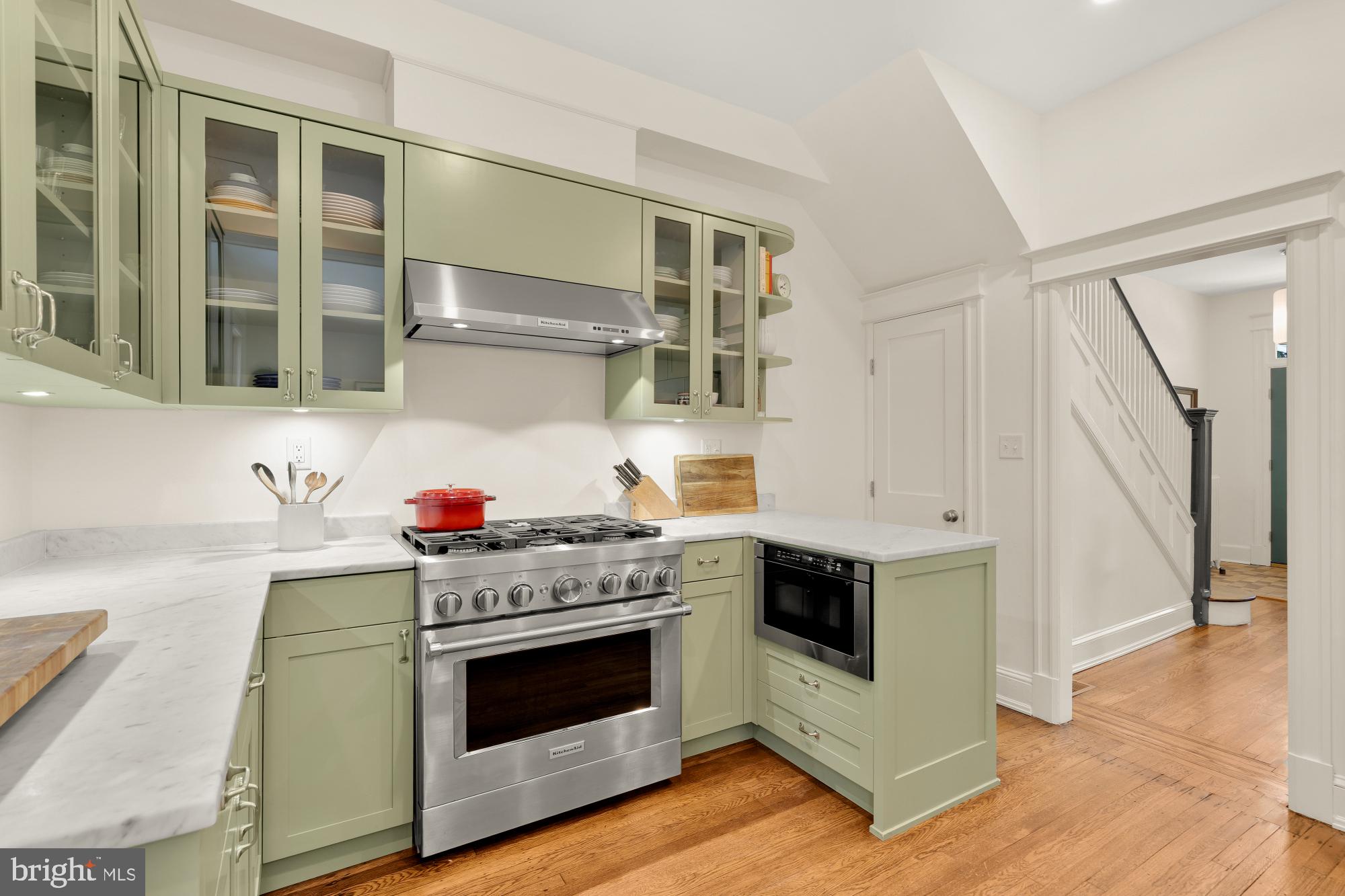 1929 Park Road Northwest Washington, DC 20010 - Photo 15 of 54 a kitchen with stainless steel appliances a stove and white cabinets