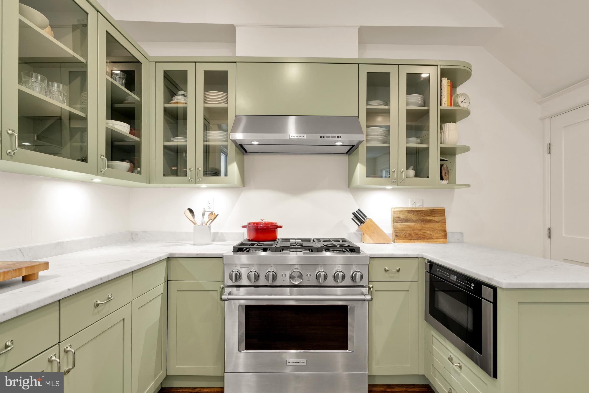 1929 Park Road Northwest Washington, DC 20010 - Photo 16 of 54 a kitchen with stainless steel appliances granite countertop a stove and a sink