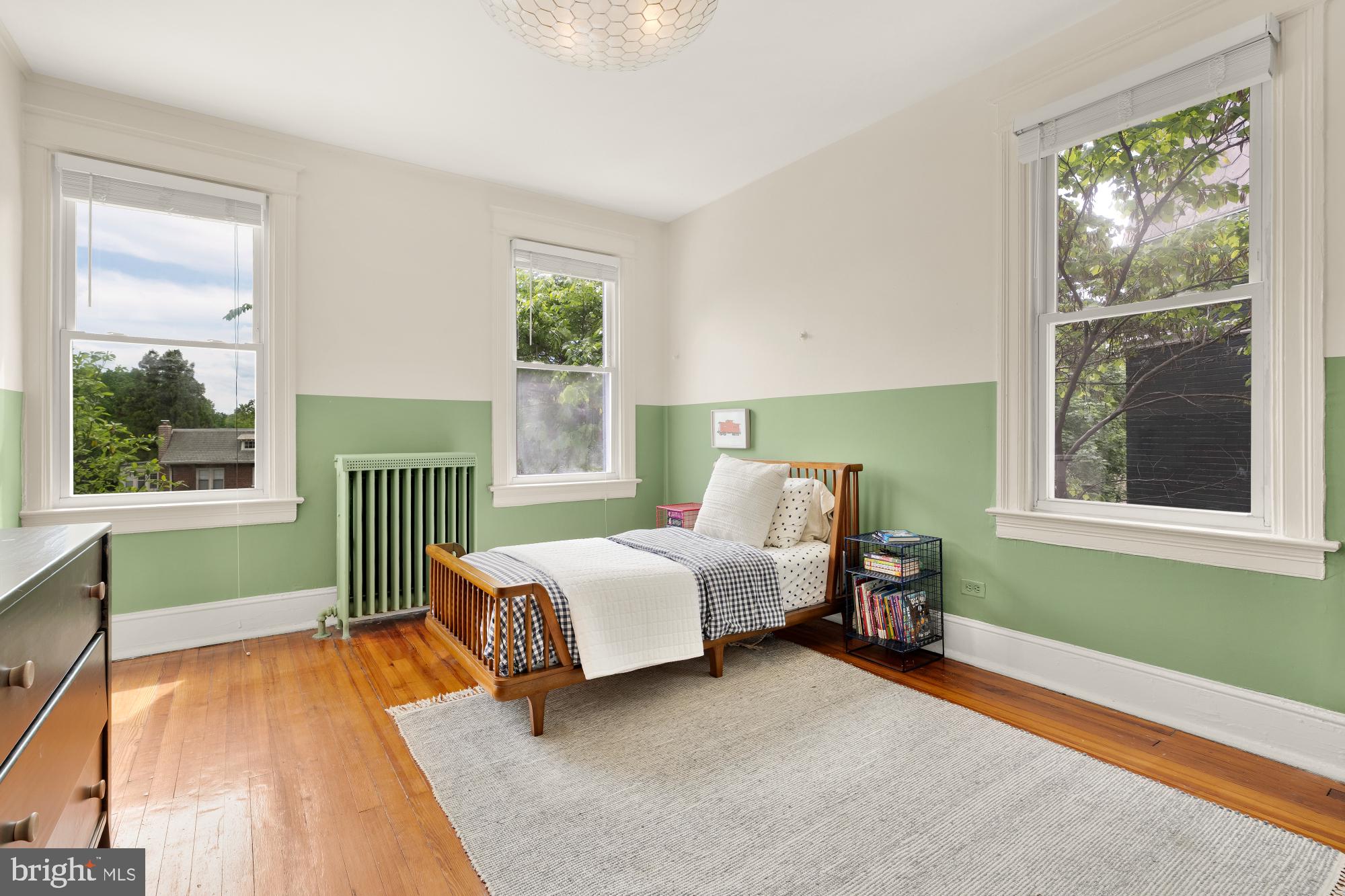 1929 Park Road Northwest Washington, DC 20010 - Photo 20 of 54 a bedroom with furniture and a large window