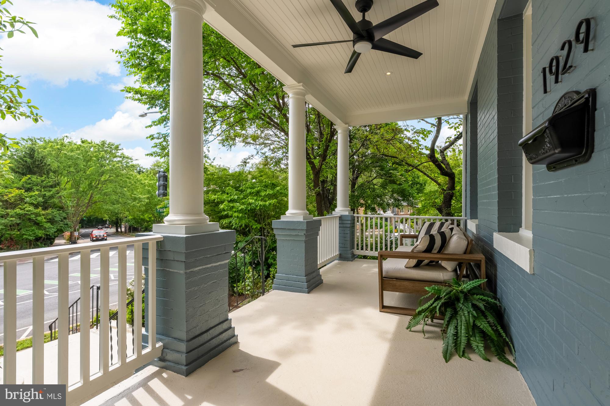 1929 Park Road Northwest Washington, DC 20010 - Photo 2 of 54 a view of a patio with a table chairs and a floor to ceiling window