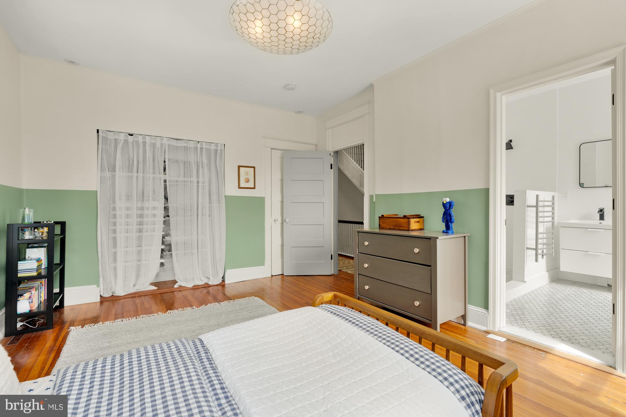1929 Park Road Northwest Washington, DC 20010 - Photo 22 of 54 a bedroom with a bed and a chandelier