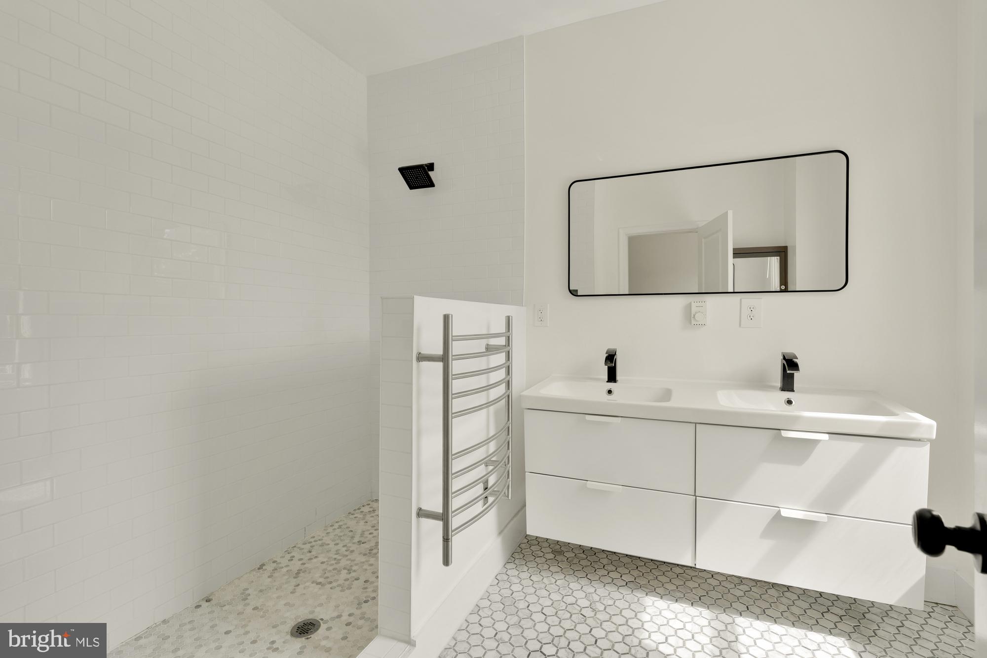 1929 Park Road Northwest Washington, DC 20010 - Photo 23 of 54 a bathroom with a sink and a mirror