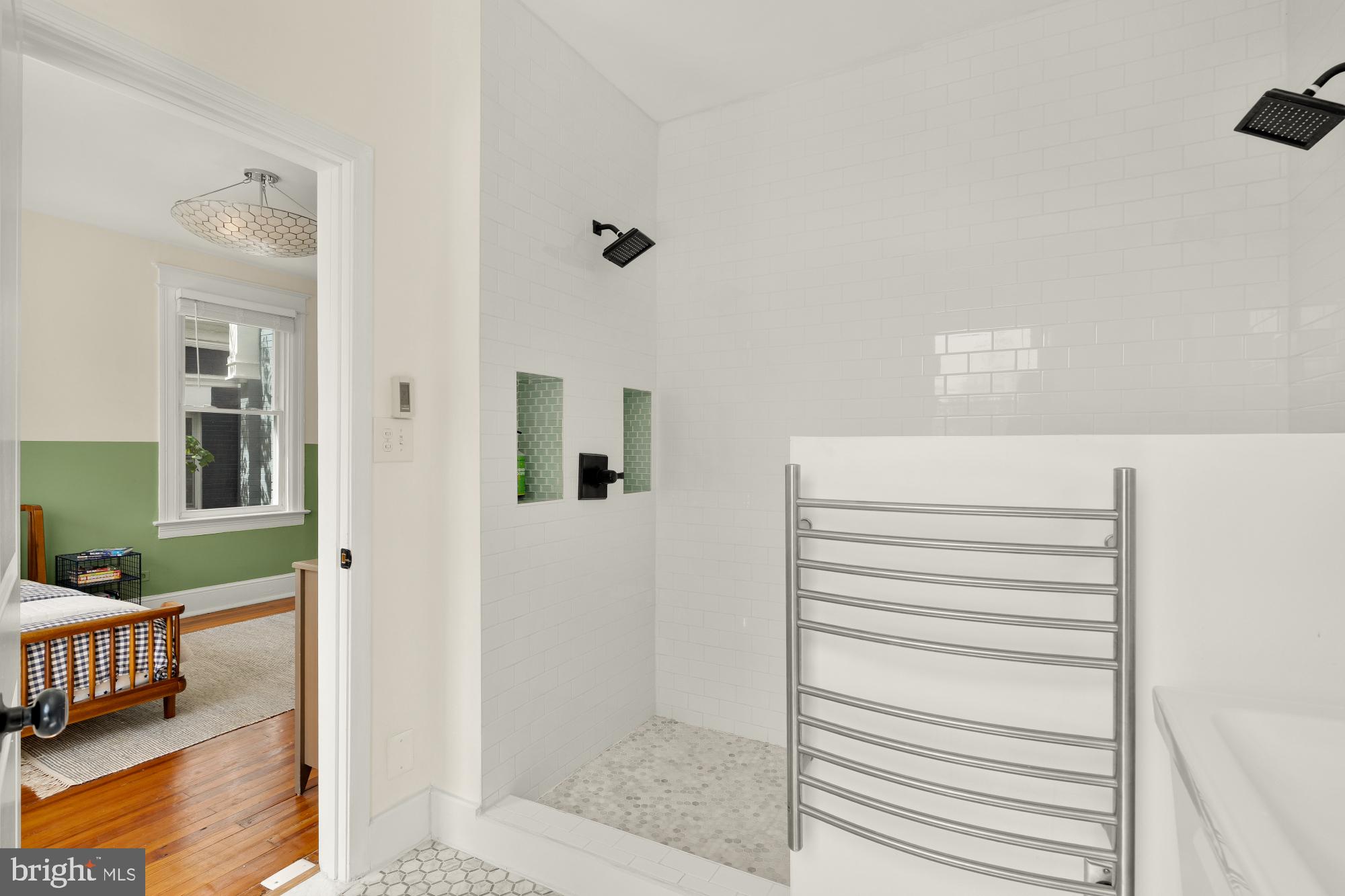 1929 Park Road Northwest Washington, DC 20010 - Photo 24 of 54 a view of a bedroom with wooden floor and furniture