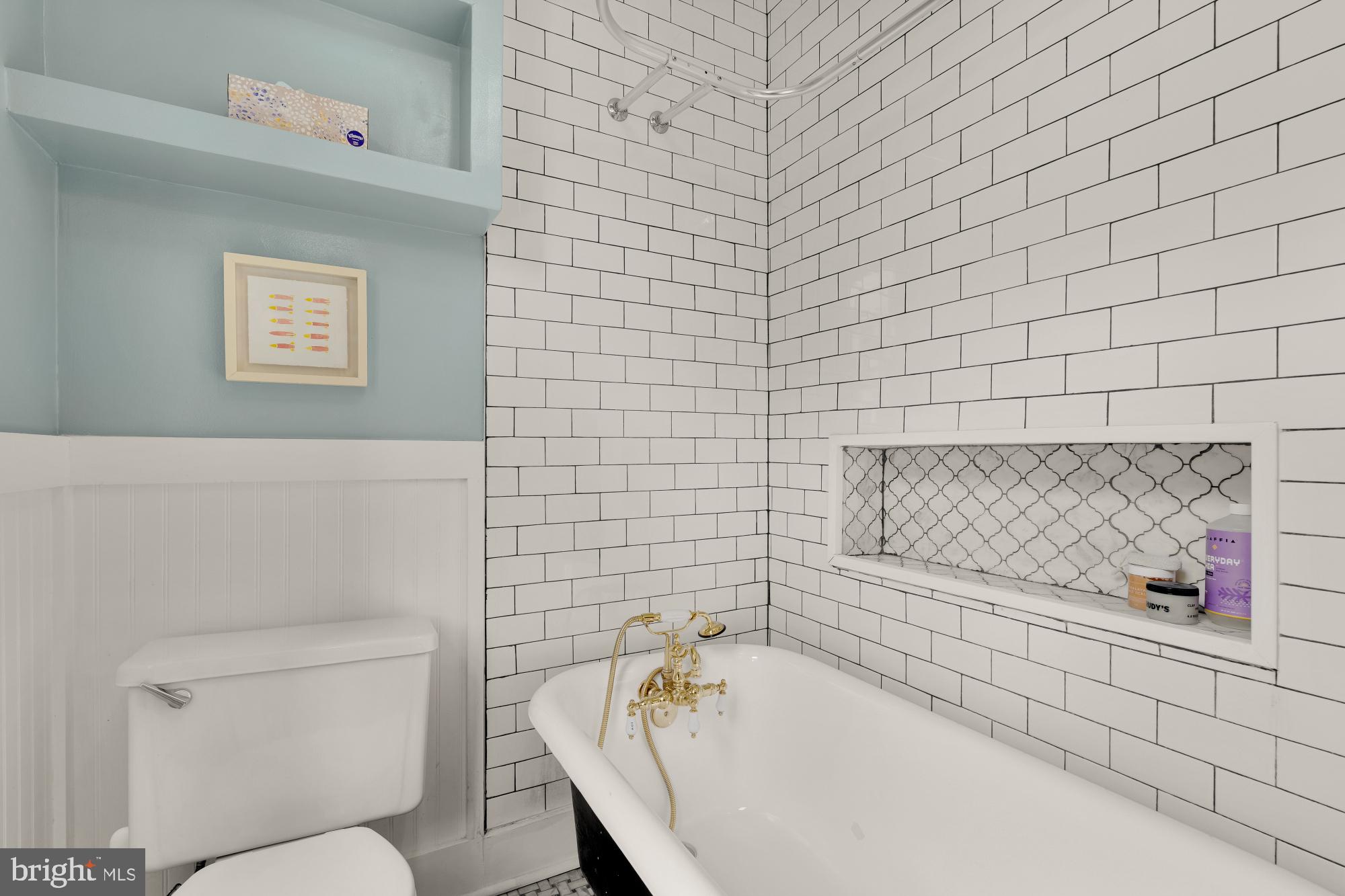 1929 Park Road Northwest Washington, DC 20010 - Photo 27 of 54 a bathroom with a bathtub and a toilet