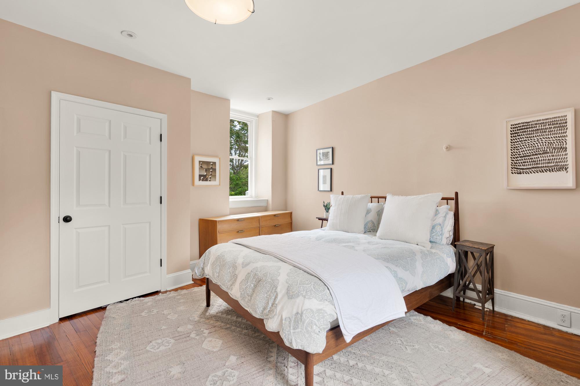 1929 Park Road Northwest Washington, DC 20010 - Photo 30 of 54 a bedroom with a bed and a window
