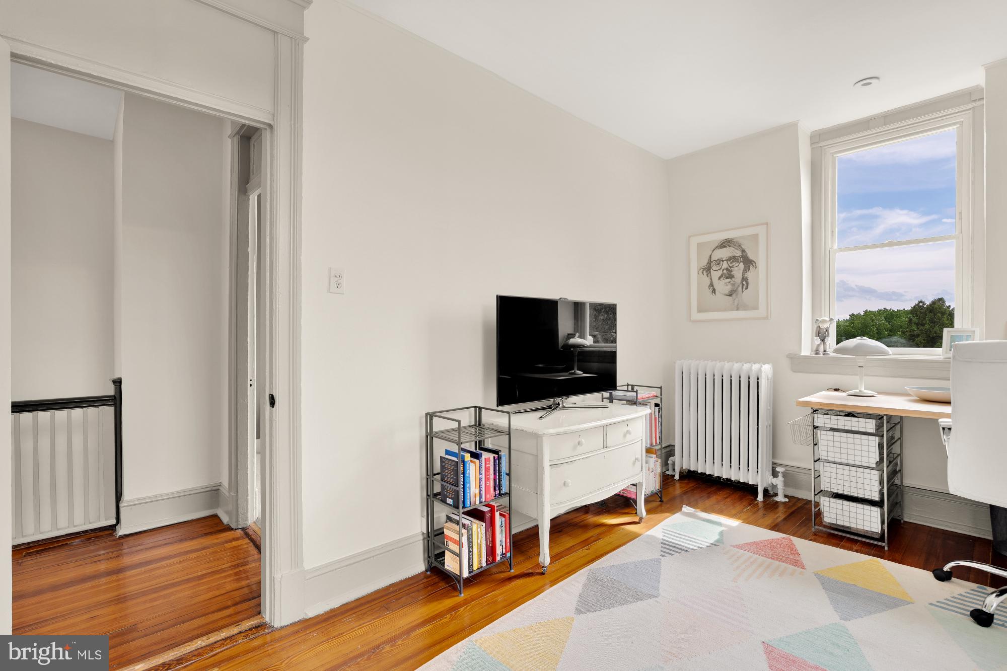 1929 Park Road Northwest Washington, DC 20010 - Photo 36 of 54 a view of a livingroom with workspace and a window