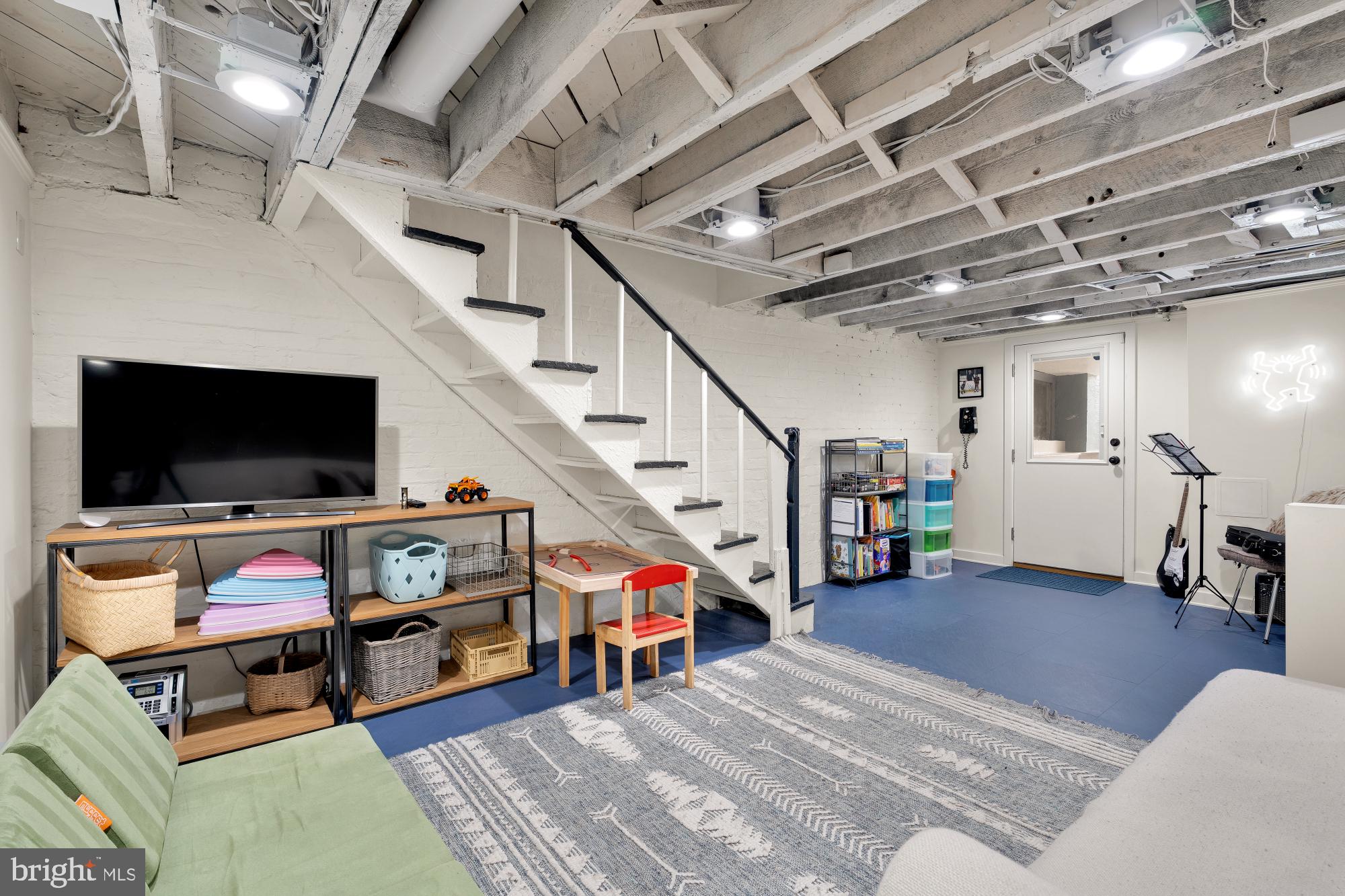 1929 Park Road Northwest Washington, DC 20010 - Photo 37 of 54 a living room with furniture and a flat screen tv
