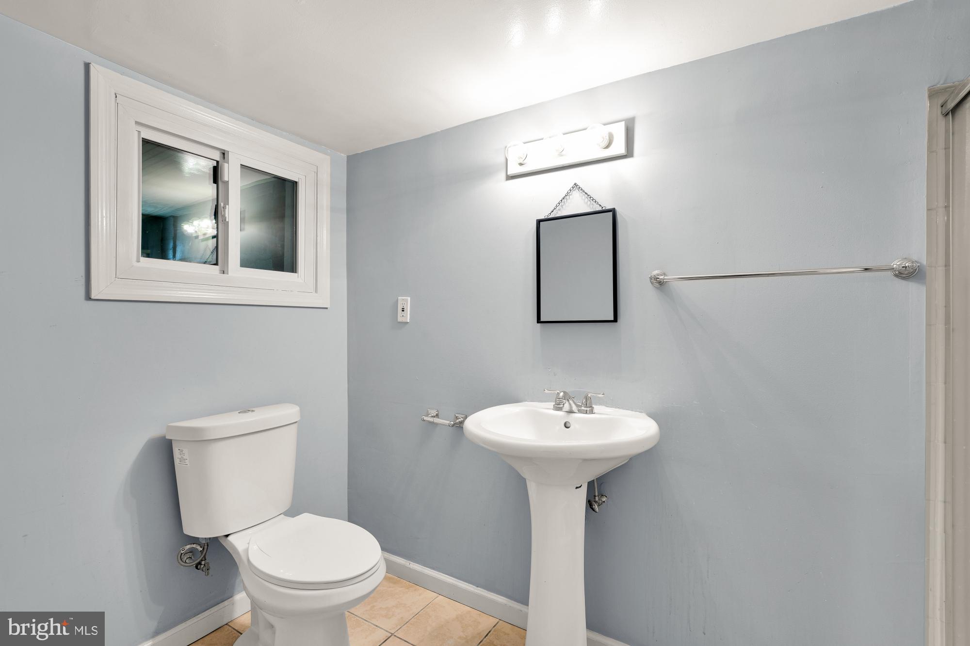 1929 Park Road Northwest Washington, DC 20010 - Photo 39 of 54 a bathroom with a toilet sink and mirror