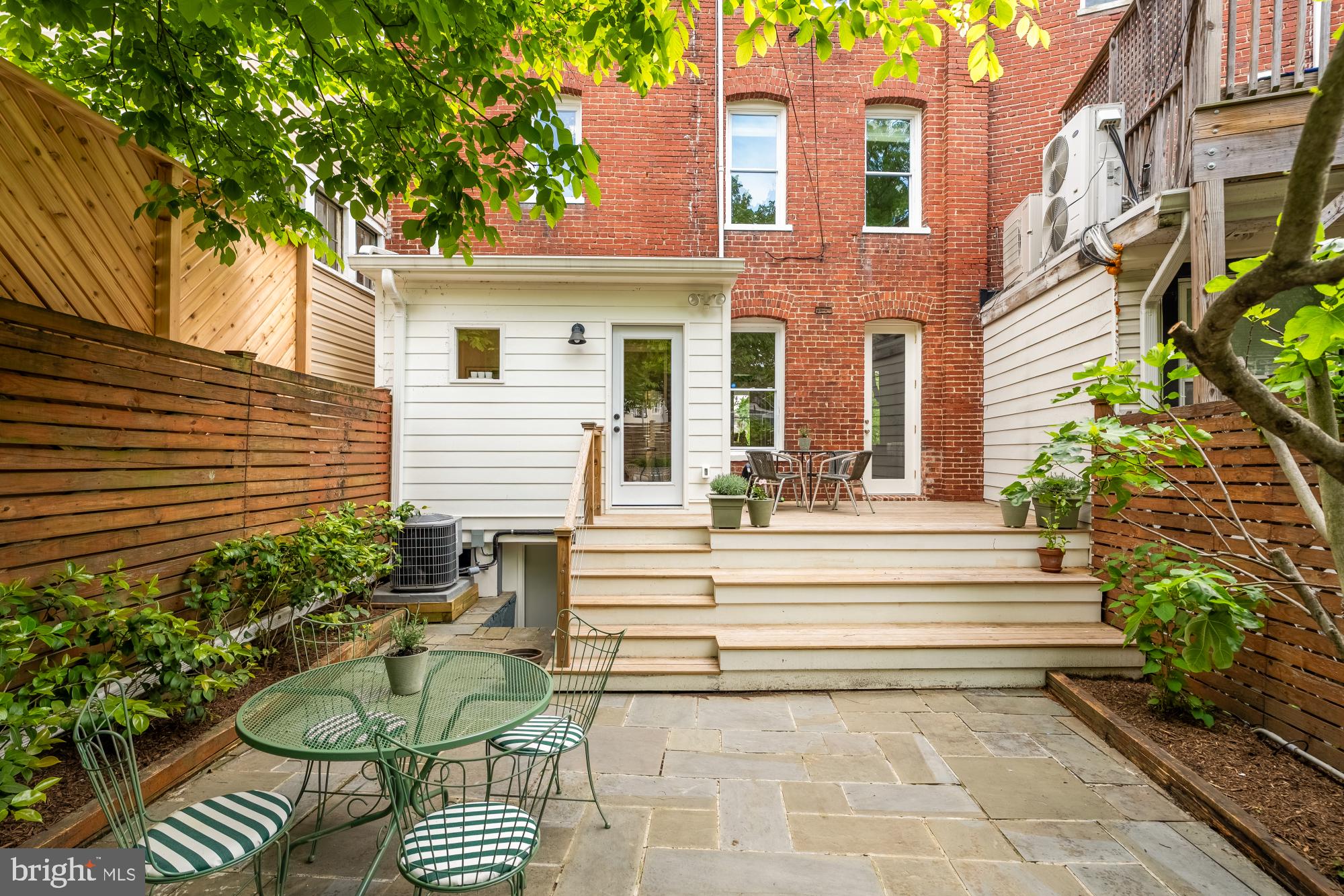 1929 Park Road Northwest Washington, DC 20010 - Photo 40 of 54 a view of a patio with a chairs and table in a patio