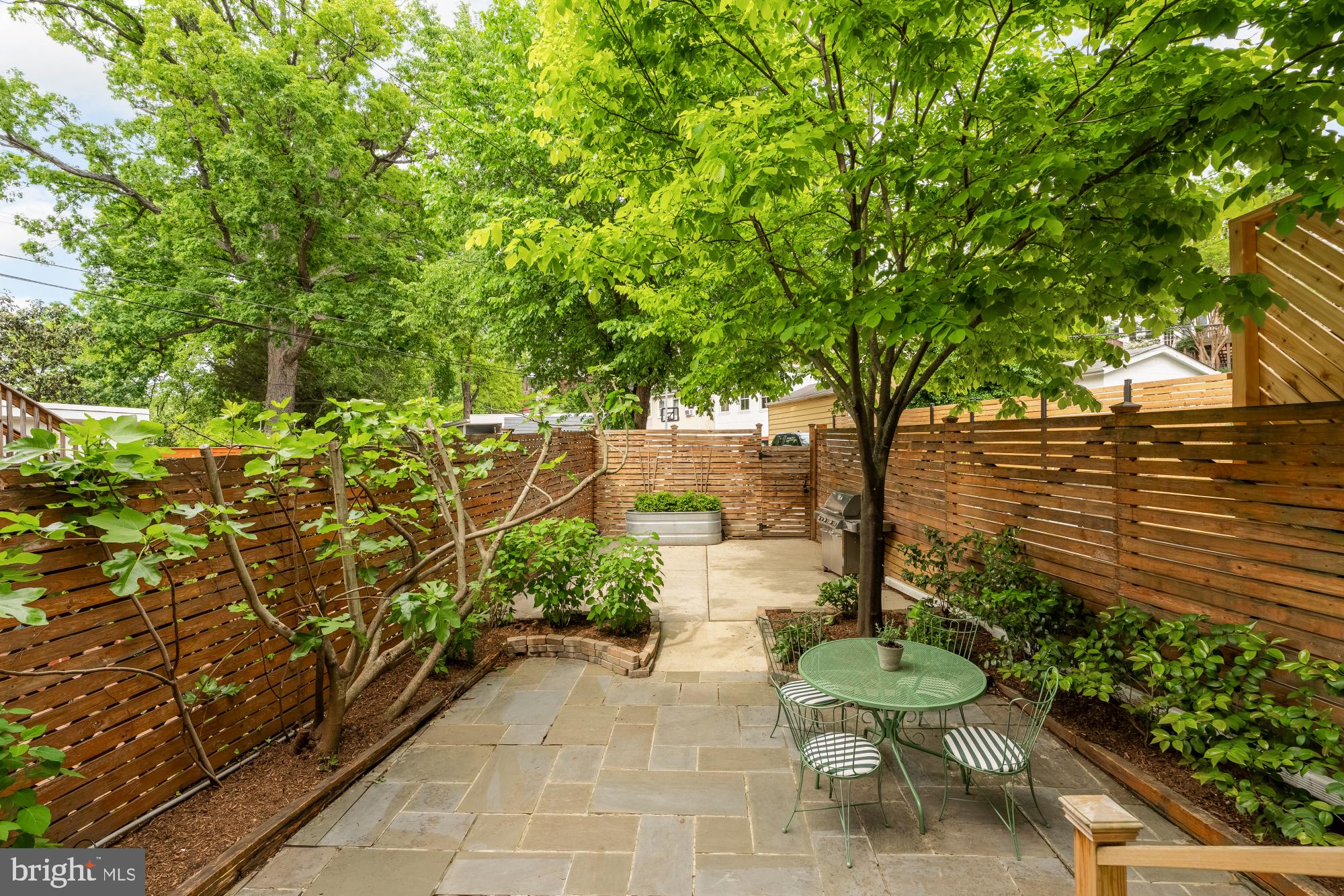 1929 Park Road Northwest Washington, DC 20010 - Photo 42 of 54 a view of a backyard with chairs and a table