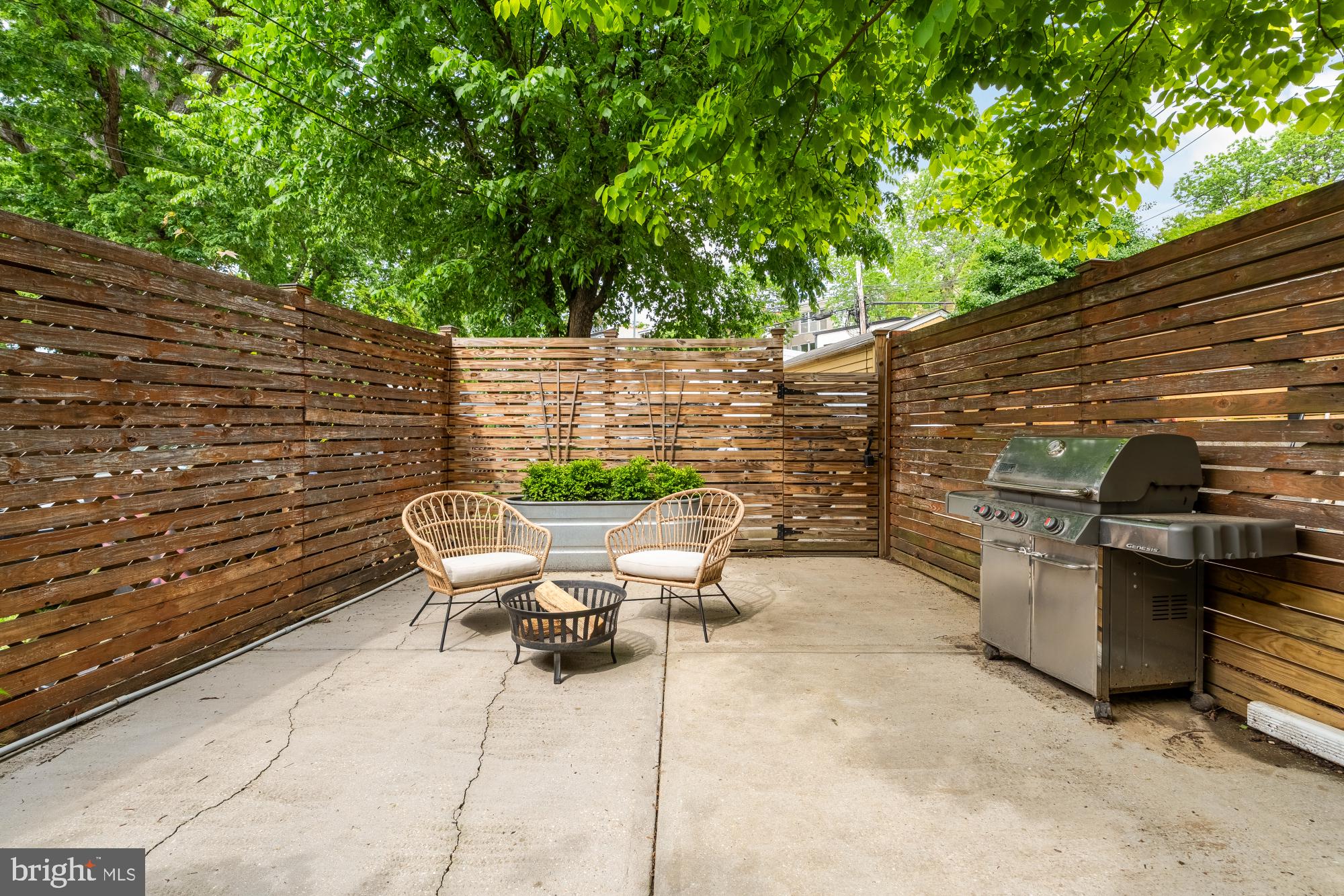 1929 Park Road Northwest Washington, DC 20010 - Photo 43 of 54 a view of a patio with table and chairs with wooden floor and fence