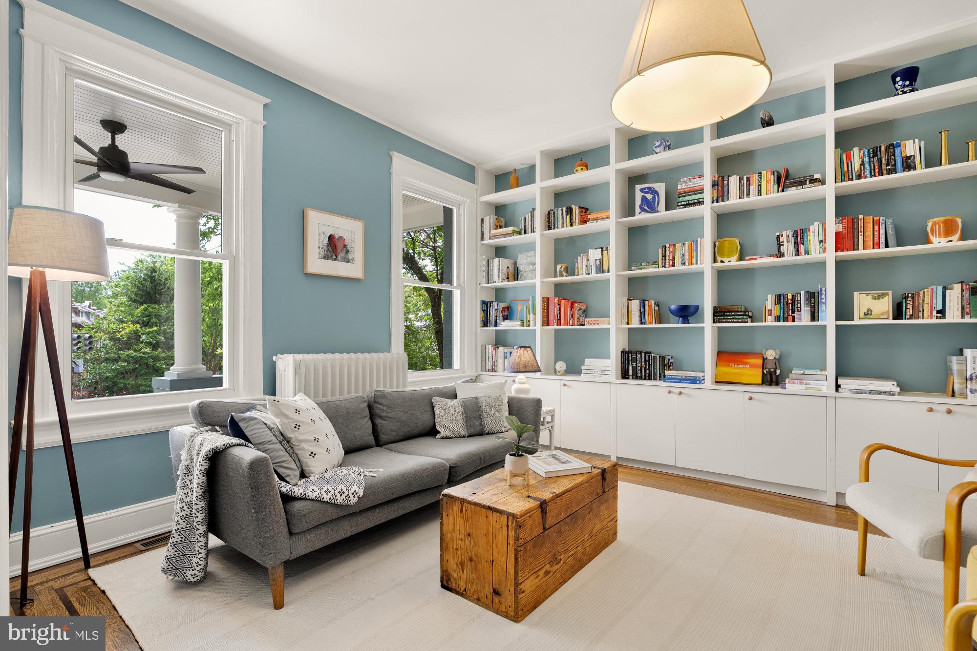 1929 Park Road Northwest Washington, DC 20010 - Photo 5 of 54 a living room with furniture and a book shelf