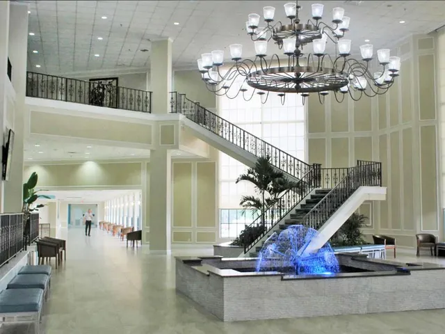 a very nice looking dining room with furniture