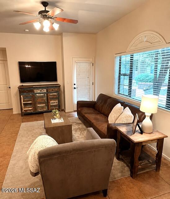 2018 East River Road, Unit 102 Tucson, AZ 85718 - Photo 7 of 25 a living room with furniture and a flat screen tv