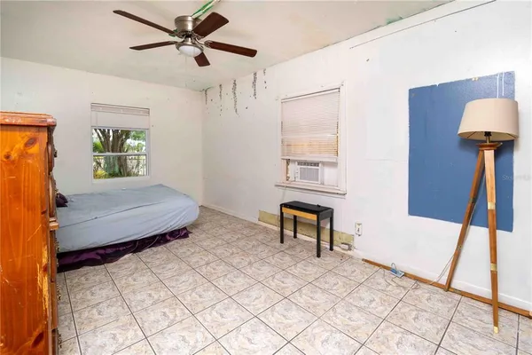 a bedroom with a bed and a table