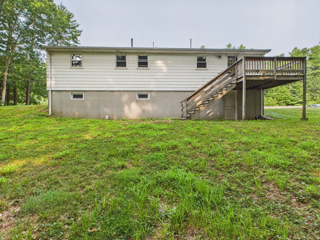 91 Old Post Road Sharon, MA 02067 - Photo 3 of 11 a view of a house with a backyard