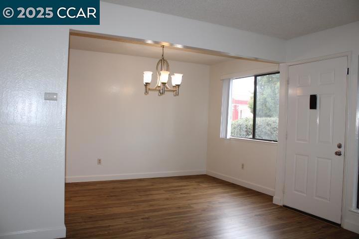 3430 San Pablo Dam Road San Pablo, CA 94803 - Photo 6 of 21 a view of a room with wooden floor and chandelier