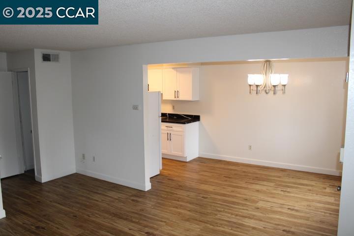 3430 San Pablo Dam Road San Pablo, CA 94803 - Photo 7 of 21 a view of empty room with wooden floor