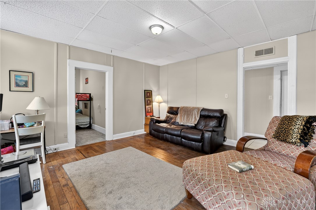 7045-7049 Montgomery Road Cincinnati, OH 45236 - Photo 59 of 68 This inviting living space features classic hardwood floors and ample natural light.