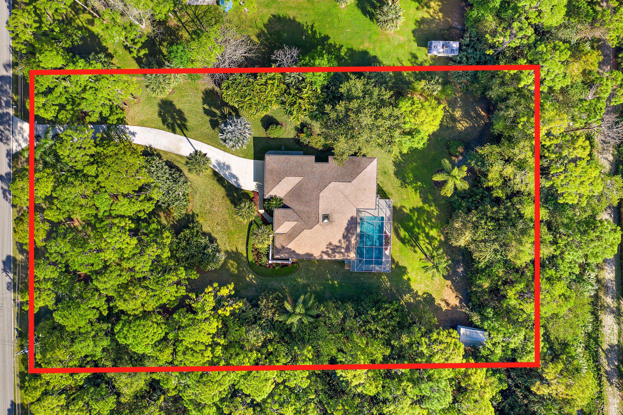 10424 Sandy Run Road Jupiter, FL 33478 - Photo 1 of 52 a view of a flower in a garden