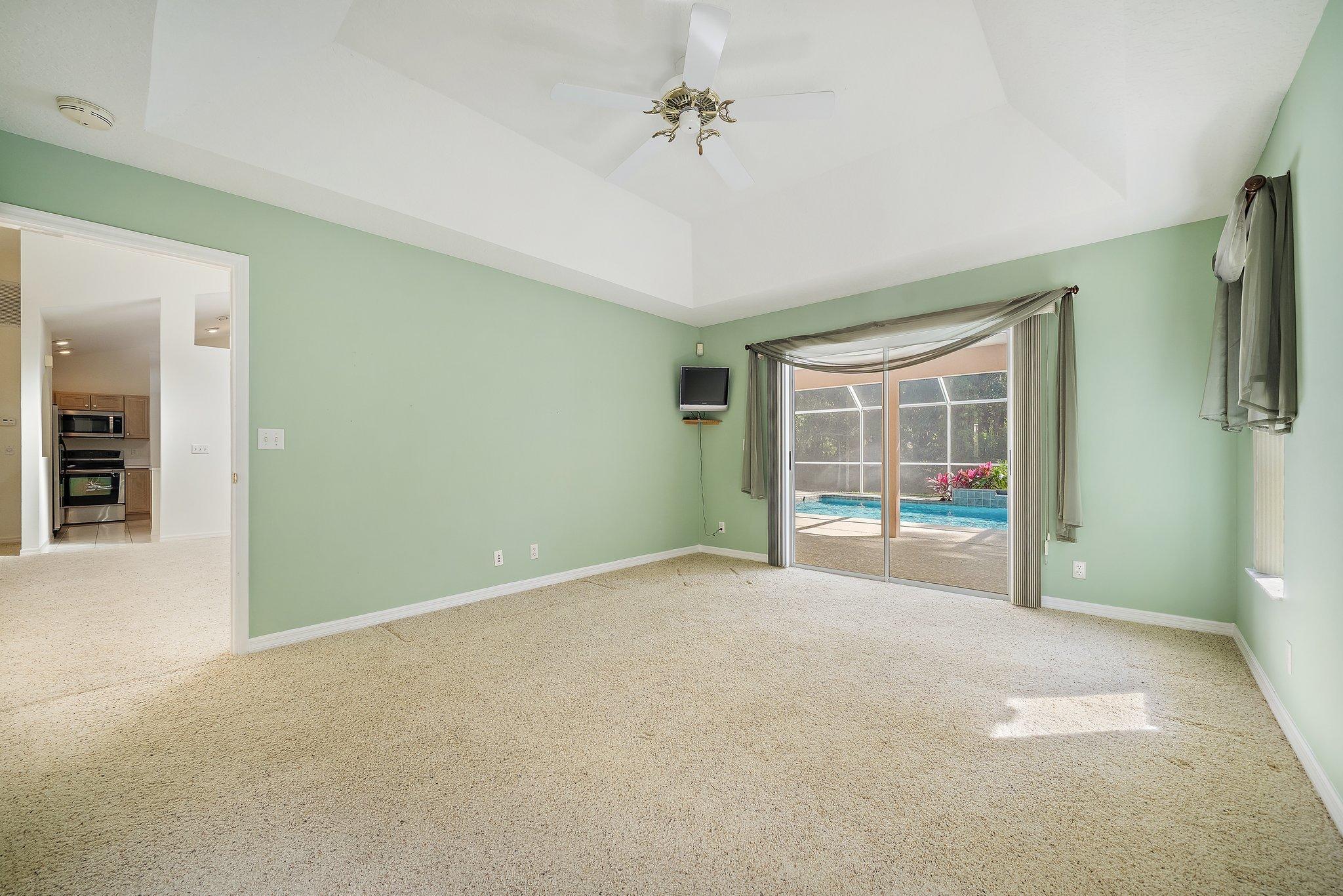 10424 Sandy Run Road Jupiter, FL 33478 - Photo 11 of 52 an empty room with windows
